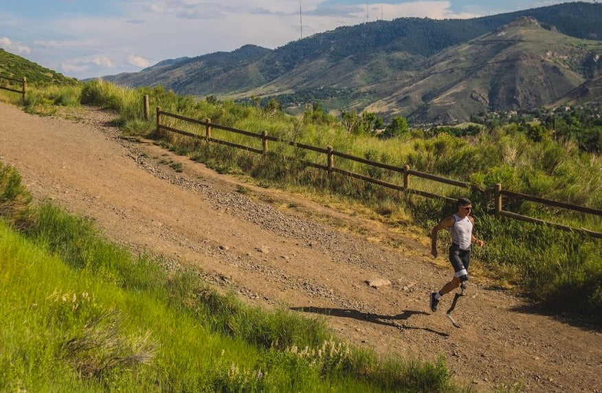 Adam running on a dirt road in Colorado